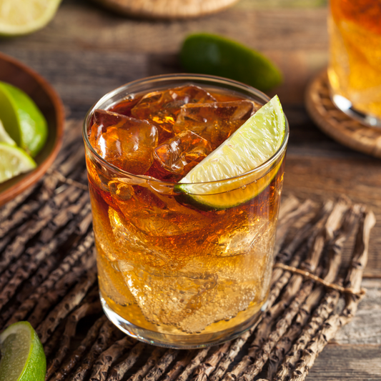 Nonalcoholic Dark & Stormy with Lime Wedge on a table