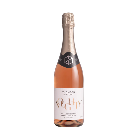 A bottle of Noughty Nonalcoholic Sparkling Rosé wine with a visible label and cork on a wooden surface.