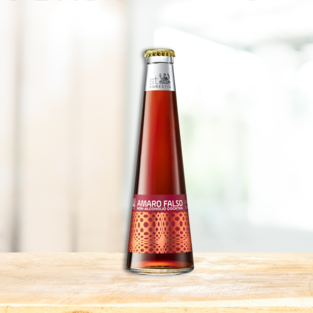 A bottle of St Agrestis Amaro Falso, an alcohol-free red beverage, with a label that includes the brand name and 'Amaro Falso' text, set against a blurred background.